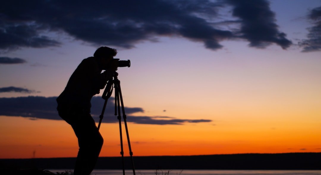silhouette-of-man-taking-picture-9sfcb8naq88